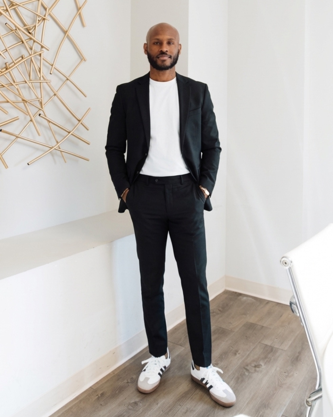 Quintel Harcum, founder of Workspace Valet, in a black suit